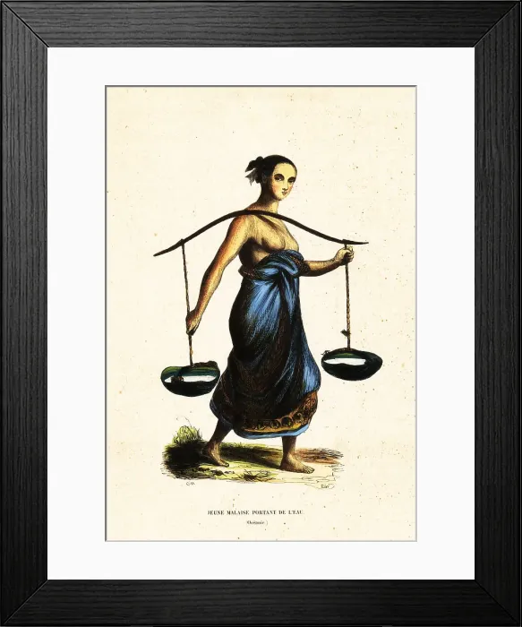 Framed Print : Young Malay woman carrying pales of water with a yoke