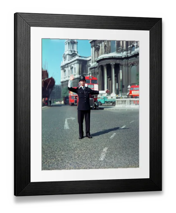 Framed Print : A London Policeman directing traffic at St. Paul's, London Framed Print : A London Policeman directing traffic at St. Paul's, London