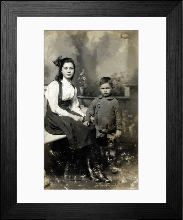 Framed Print : Teenage girl poses for a studio portrait with young brother Framed Print : Teenage girl poses for a studio portrait with young brother