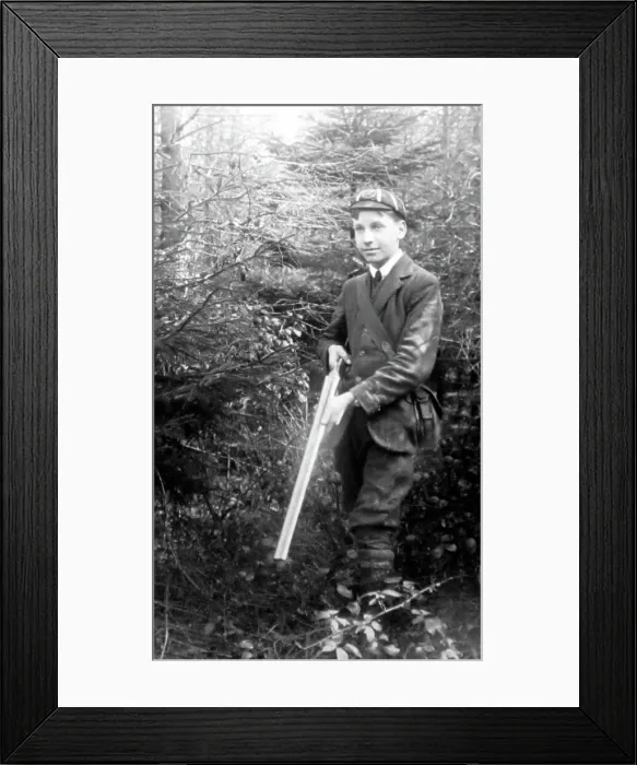 Framed Print : Boy with double-barrelled shotgun, early 1900s Framed Print : Boy with double-barrelled shotgun, early 1900s