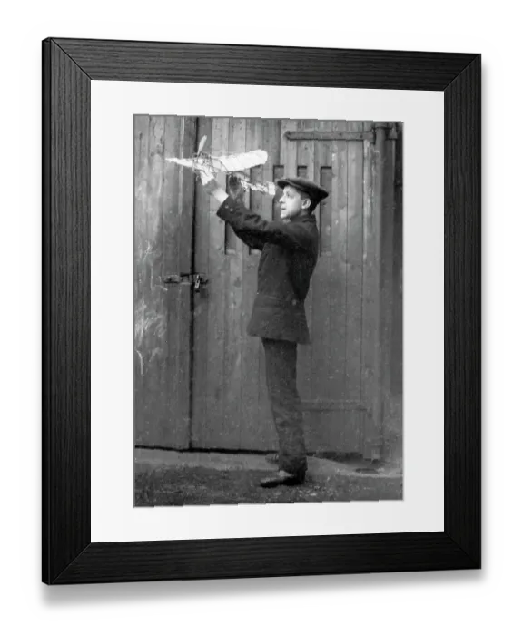 Framed Print : Boy with model aeroplane Framed Print : Boy with model aeroplane