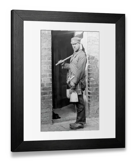 Framed Print : A coal miner arrives home after a shift