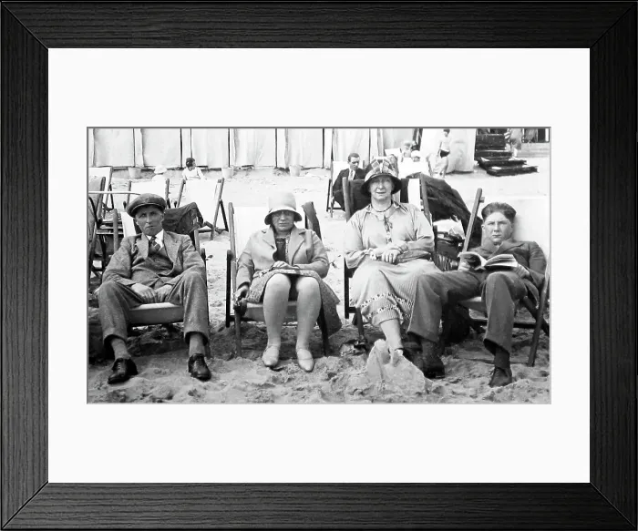 Framed Print : Holidaymakers not having fun on the beach in the 1920s Framed Print : Holidaymakers not having fun on the beach in the 1920s