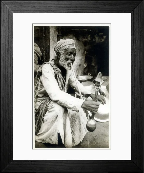 Framed Print : Egyptian man smoking a long-stemmed Hookah pipe Framed Print : Egyptian man smoking a long-stemmed Hookah pipe