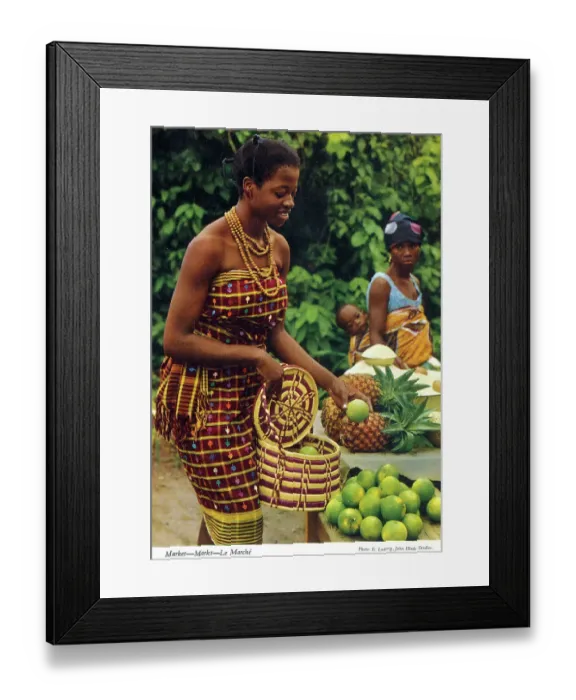 Framed Print : Africa - Woman buying limes at an African market Framed Print : Africa - Woman buying limes at an African market