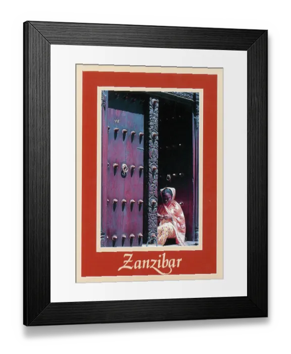 Framed Print : Africa - Zanzibar - Girl in ornately-carved wooden doorway