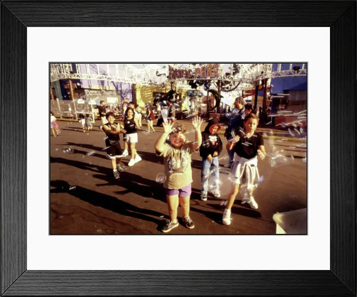 Framed Print : Children chasing soapbubbles Santa Monica beach, USA Framed Print : Children chasing soapbubbles Santa Monica beach, USA