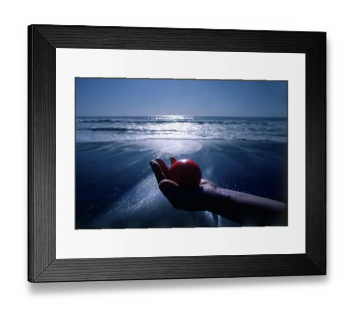 Framed Print : Hand holding red ball Moonstone Beach, California, USA Framed Print : Hand holding red ball Moonstone Beach, California, USA