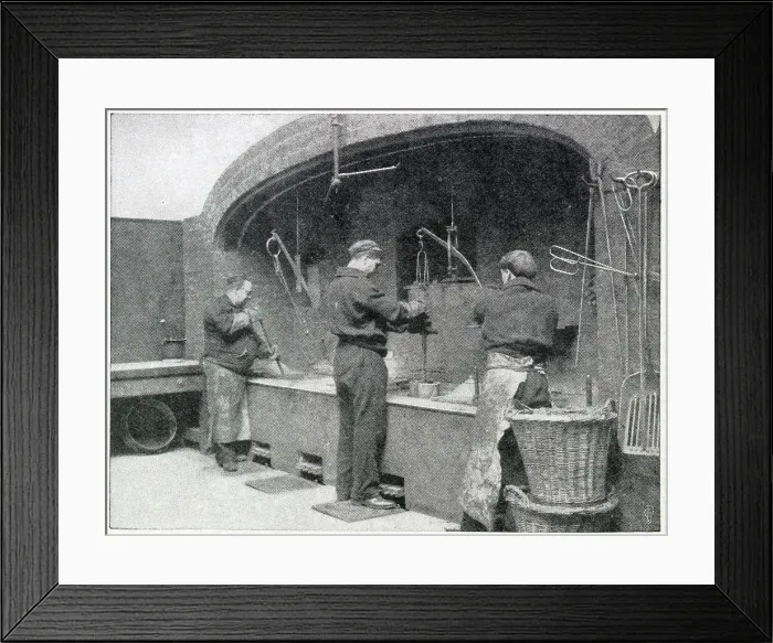 Framed Print : Before the furnace in the melting room, reducing the silver ingots into a molten state crucible of plumbago were used, each capable of holding 5, 500 ounces of the metal. Date: 1904 Framed Print : Before the furnace in the melting room, reducing the silver ingots into a molten state crucible of plumbago were used, each capable of holding 5, 500 ounces of the metal. Date: 1904