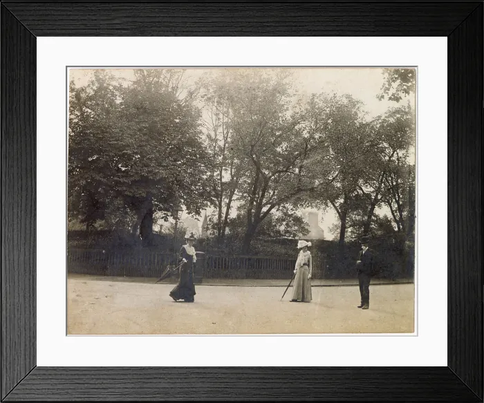 Framed Print : Man and two women in the middle of a road, possibly in Oxfordshire. Both women are carrying parasols. Date: circa 1890 Framed Print : Man and two women in the middle of a road, possibly in Oxfordshire. Both women are carrying parasols. Date: circa 1890