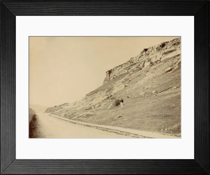 Framed Print : View at side of Little Ormes Head, North Wales, with a man standing partway up the slope Date: circa 1889 Framed Print : View at side of Little Ormes Head, North Wales, with a man standing partway up the slope Date: circa 1889
