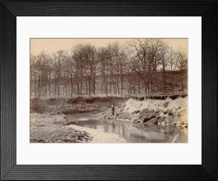 Framed Print : Woolfe family of The Clough, Hale, Bucklow, Cheshire - boy standing by the River Bollin, with bare trees in the background. Date: circa 1889 Framed Print : Woolfe family of The Clough, Hale, Bucklow, Cheshire - boy standing by the River Bollin, with bare trees in the background. Date: circa 1889