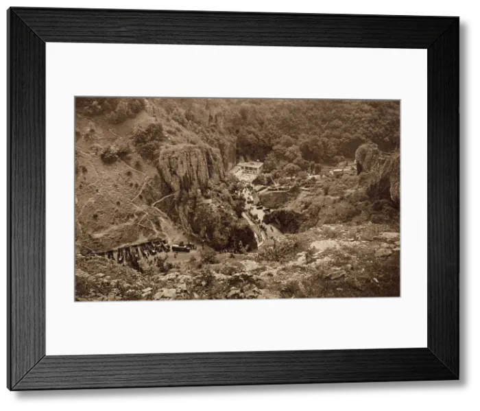 Framed Print : General aerial view, Gough's Caves, Cheddar, Somerset, with Cave Man Restaurant and parking area. Date: circa 1930 Framed Print : General aerial view, Gough's Caves, Cheddar, Somerset, with Cave Man Restaurant and parking area. Date: circa 1930