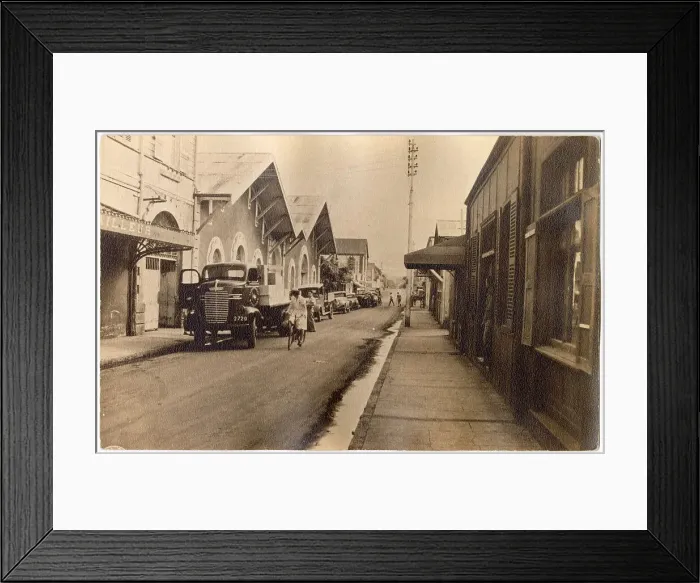 Framed Print : Street in the Far East, with shipping company and Dodge truck Date: late 1930s Framed Print : Street in the Far East, with shipping company and Dodge truck Date: late 1930s