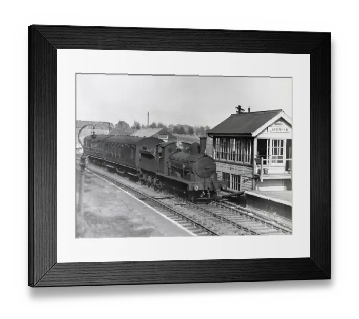Framed Print : Steam locomotive and passenger carriages alongside a signal box near Lavenham, Suffolk. Date: circa 1960s Framed Print : Steam locomotive and passenger carriages alongside a signal box near Lavenham, Suffolk. Date: circa 1960s