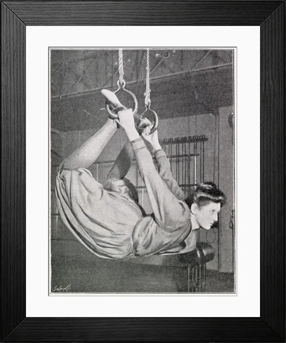 Framed Print : A woman using flying rings. Date: 1901 Framed Print : A woman using flying rings. Date: 1901