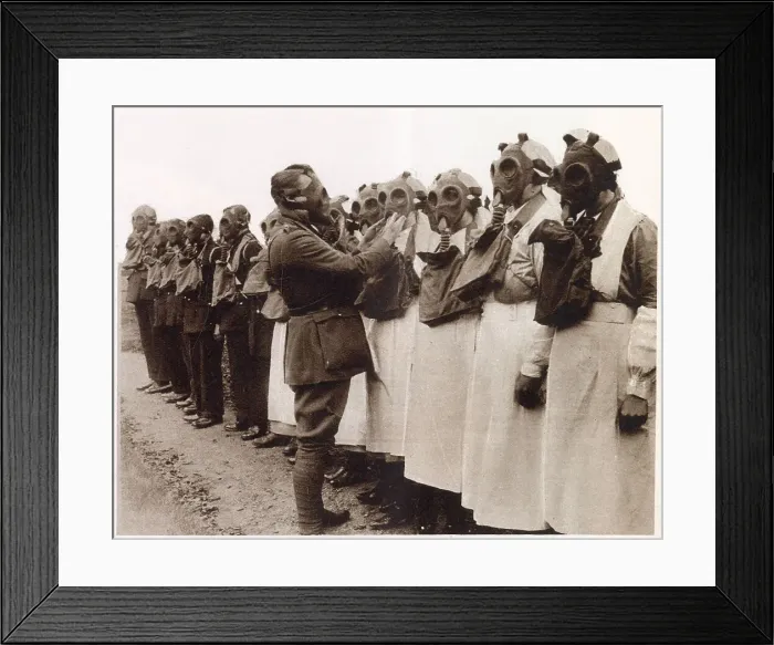 Framed Print : Members of the Red Cross nurses of the Camberwell division learning how to use gas masks, under expert supervision of a Territorial Officer. Date: December 1933 Framed Print : Members of the Red Cross nurses of the Camberwell division learning how to use gas masks, under expert supervision of a Territorial Officer. Date: December 1933