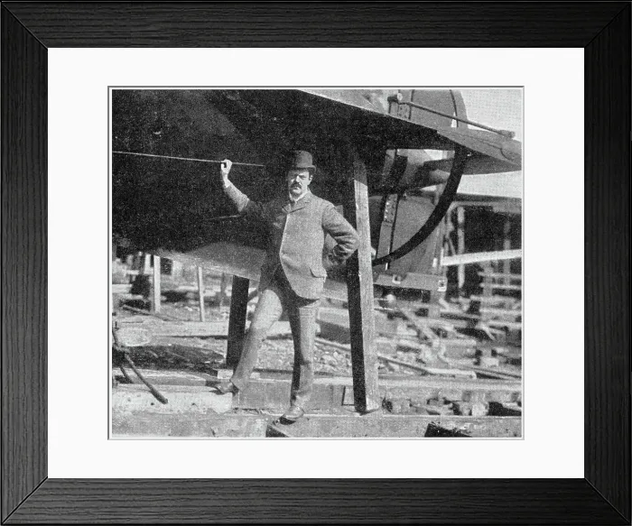 Framed Print : Lewis Nixon (1861 - 1940), naval architect and designer, shipbuilding executive, public servant, and political activist. Photograph showing Nixon standing at the tail end of one of his submarines in the Holland Company's yard. Date: 1902 Framed Print : Lewis Nixon (1861 - 1940), naval architect and designer, shipbuilding executive, public servant, and political activist. Photograph showing Nixon standing at the tail end of one of his submarines in the Holland Company's yard. Date: 1902