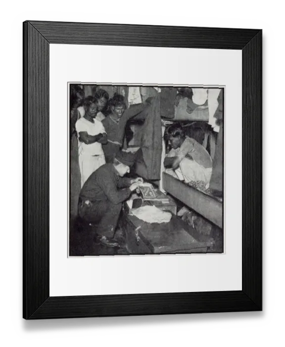 Framed Print : A customs official from the flying squad searches the quarters of a Lascar crew of a sugar freighter to check no dutiable goods have been hidden in odd corners. Date: 1932