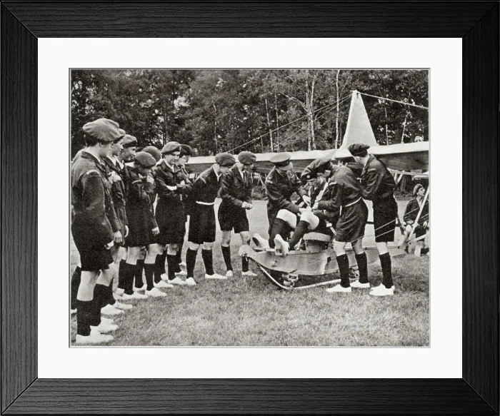 Framed Print : Flt.Lieut. Wilson helping to adjust the equipment of the pilot as one of the boys prepares to take off in a glider. Date: 1959 Framed Print : Flt.Lieut. Wilson helping to adjust the equipment of the pilot as one of the boys prepares to take off in a glider. Date: 1959