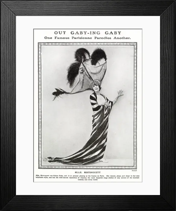 Framed Print : Mistinguett, performing at the Casino de Paris, parodying fellow Parisian performer Gaby Deslys by wearing enormous, flamboyant hat. Date: 1919 Framed Print : Mistinguett, performing at the Casino de Paris, parodying fellow Parisian performer Gaby Deslys by wearing enormous, flamboyant hat. Date: 1919
