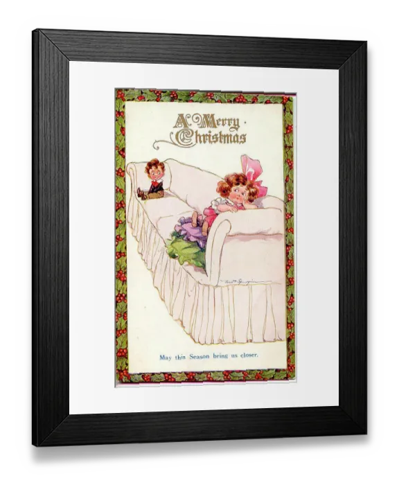 Framed Print : Christmas postcard, Little girl and boy on a long sofa - May this Season bring us closer Date: early 20th century