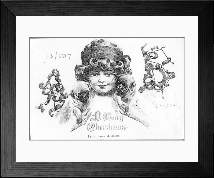 Framed Print : Christmas postcard, Girl with mistletoe and puppies - From your darlings. Date: early 20th century Framed Print : Christmas postcard, Girl with mistletoe and puppies - From your darlings. Date: early 20th century