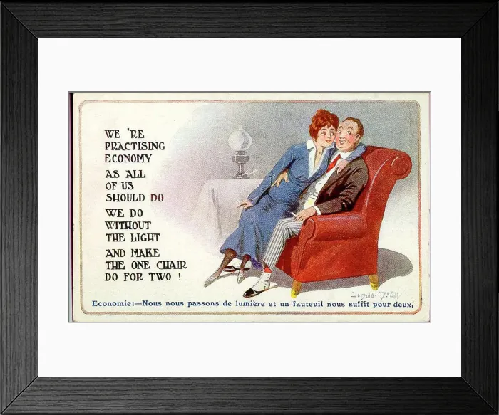 Framed Print : Comic postcard, Young couple in an armchair with the light out - making the best of wartime restrictions. Date: 1914-1918 Framed Print : Comic postcard, Young couple in an armchair with the light out - making the best of wartime restrictions. Date: 1914-1918