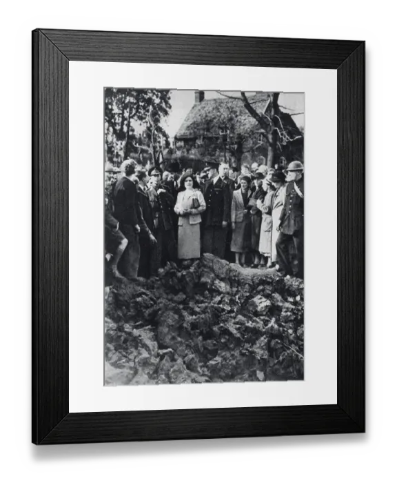 Framed Print : King George VI and Queen Elizabeth watching an air battle while visiting bombed areas in London. They are standing on the edge of a large crater. Date: 27th September 1940 Framed Print : King George VI and Queen Elizabeth watching an air battle while visiting bombed areas in London. They are standing on the edge of a large crater. Date: 27th September 1940