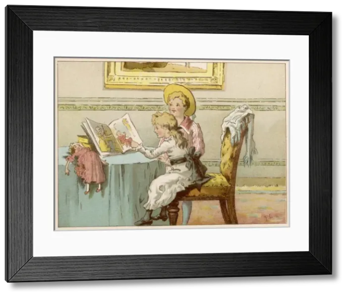 Framed Print : Children at table with picture book Framed Print : Children at table with picture book