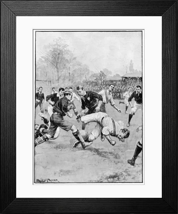 Framed Print : A player falls during a football match Framed Print : A player falls during a football match