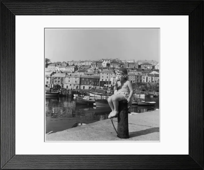Framed Print : Little girl eating an ice cream, Cornwall Framed Print : Little girl eating an ice cream, Cornwall