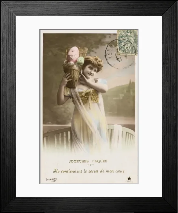 Framed Print : Young woman with a basket full of Easter eggs Framed Print : Young woman with a basket full of Easter eggs