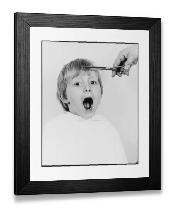 Framed Print : Small boy having a haircut Framed Print : Small boy having a haircut
