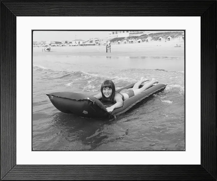 Framed Print : Girl on a Lilo