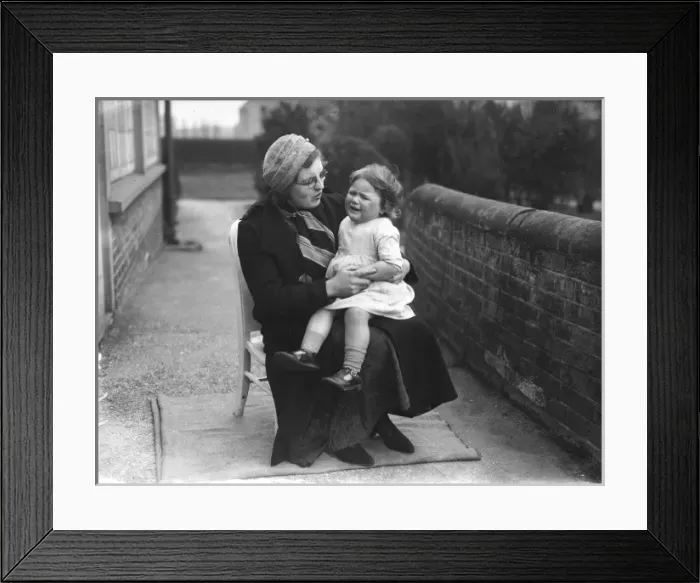 Framed Print : Comforting a Crying Girl