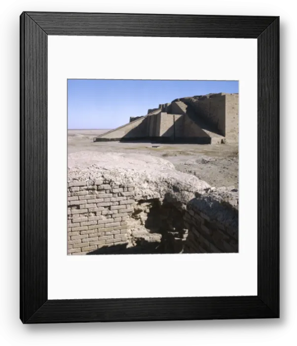 Framed Print : IRAQ / UR. Excavated residential housewalls and part of the reconstructed Ziggurat Framed Print : IRAQ / UR. Excavated residential housewalls and part of the reconstructed Ziggurat