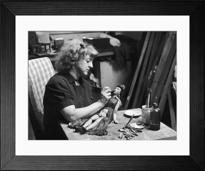 Framed Print : Hand-Painting a Puppet Framed Print : Hand-Painting a Puppet
