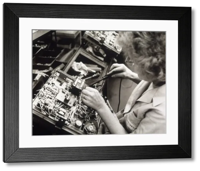 Framed Print : Woman in Factory / 1971 Framed Print : Woman in Factory / 1971