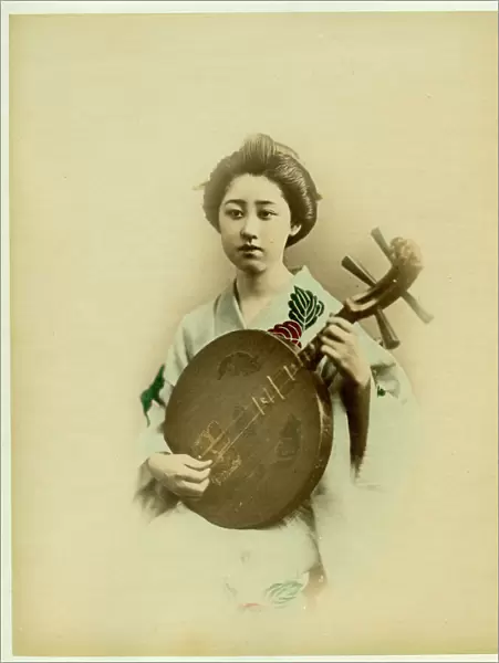 Geisha playing musical instrument