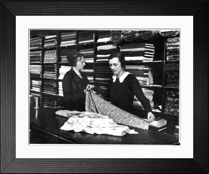 Framed Print : Fabric Shop Assistant Framed Print : Fabric Shop Assistant