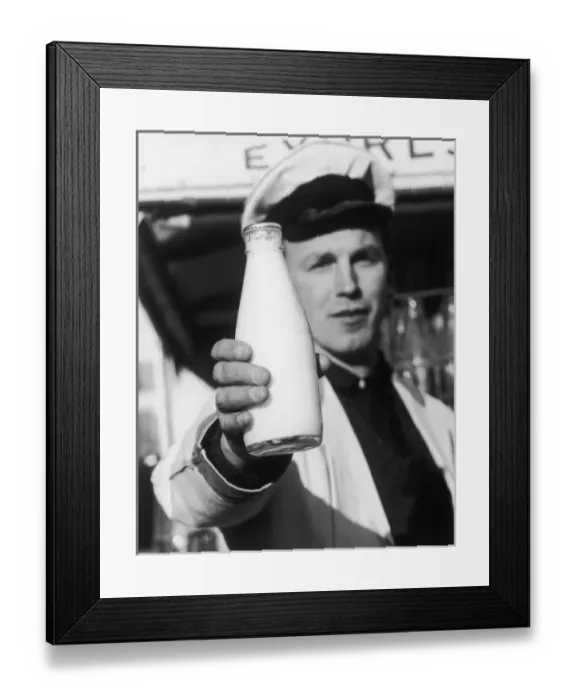 Framed Print : Milkman Holds Bottle Framed Print : Milkman Holds Bottle