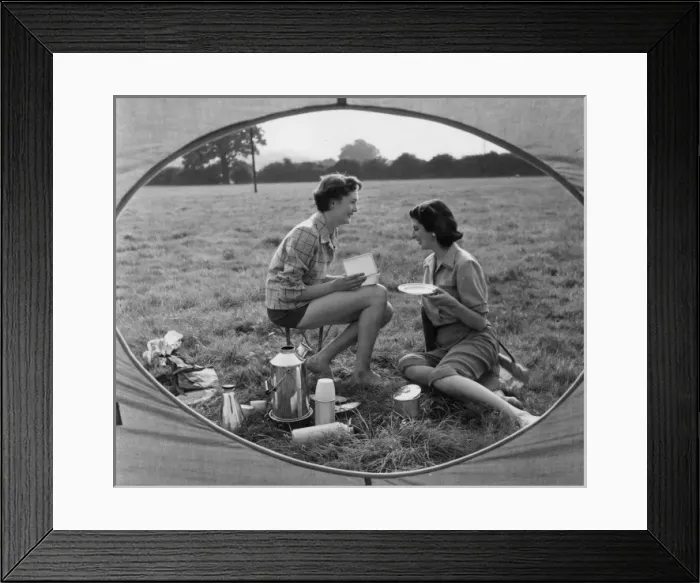 Framed Print : MEAL TIME. Two women enjoying a meal- whatever is in that box must be very tasty Framed Print : MEAL TIME. Two women enjoying a meal- whatever is in that box must be very tasty