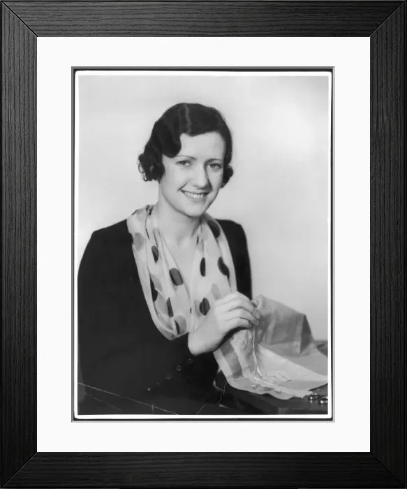Framed Print : Woman Sews Paper Pattern Framed Print : Woman Sews Paper Pattern