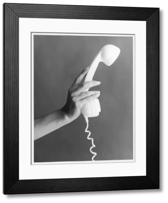 Framed Print : Hand Holds a Telephone Framed Print : Hand Holds a Telephone