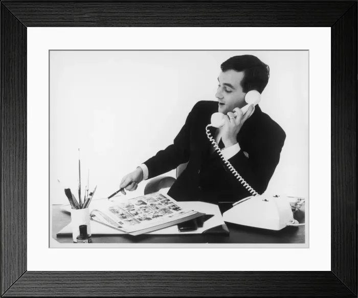 Framed Print : Man at Desk on Phone Framed Print : Man at Desk on Phone