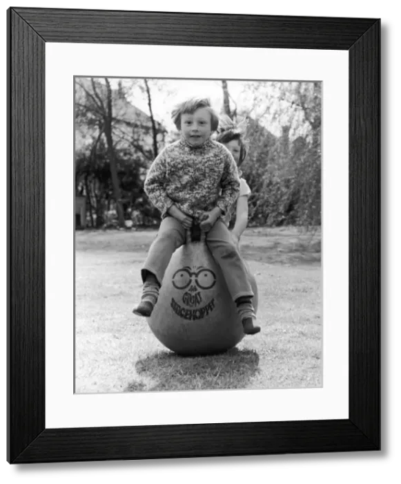 Framed Print : Kids on a Spacehopper Framed Print : Kids on a Spacehopper
