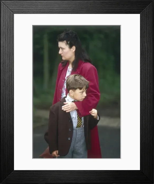 Framed Print : Evacuation / Mother & Son Framed Print : Evacuation / Mother & Son