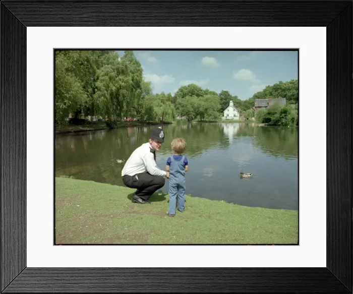 Framed Print : Police Officer and Child Framed Print : Police Officer and Child