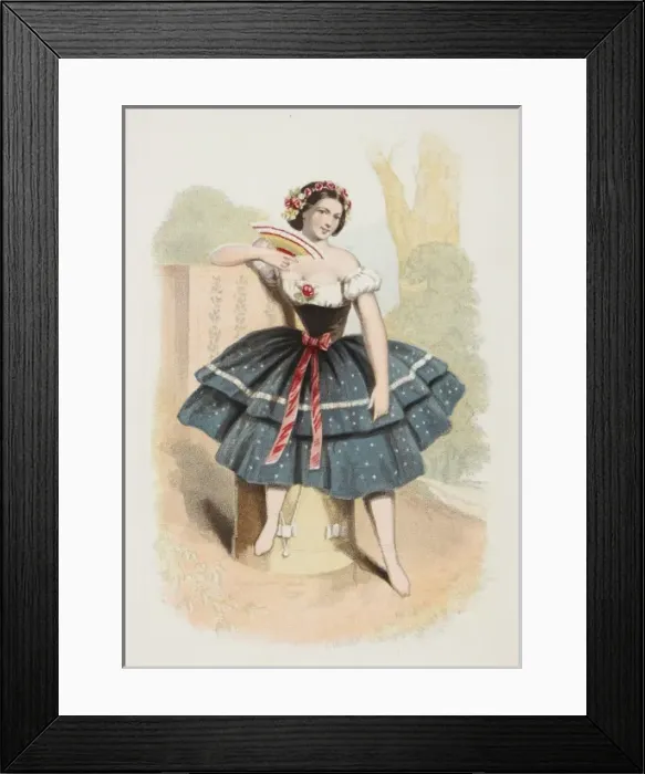 Framed Print : Ballerina. A ballerina in a folk-inspired costume poses and flirts with a fan Framed Print : Ballerina. A ballerina in a folk-inspired costume poses and flirts with a fan